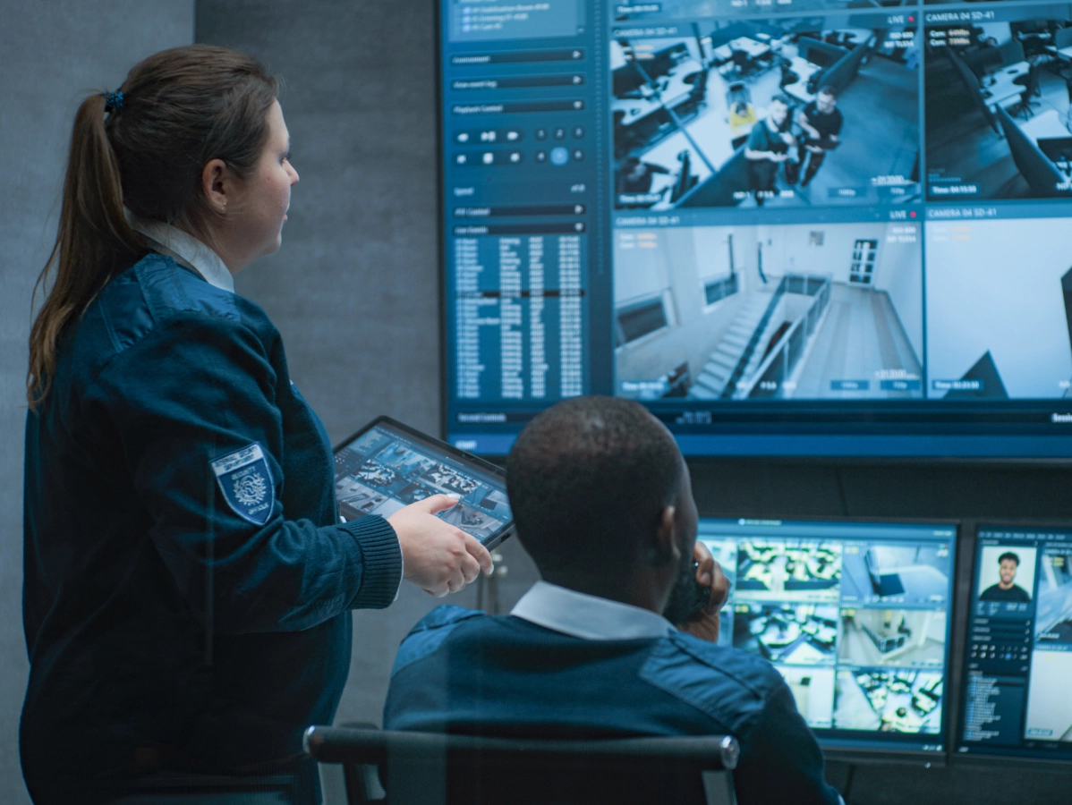 Security team monitoring surveillance camera feeds.